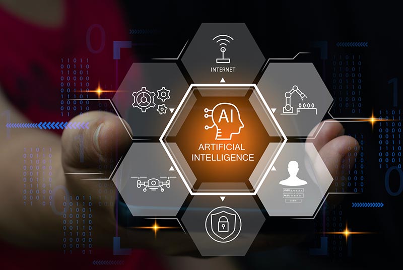 An open human hand overlaid with digital hexagons labeled with AI and Industry 4.0 terms and icons surrounding a central "Artificial Intelligence" hexagon. This highlights the synergy between AI and IoT in modern manufacturing.