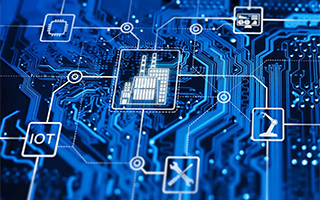 Close-up of a blue circuit board with various digital icons representing the edge capabilities of IoT and industrial automation.